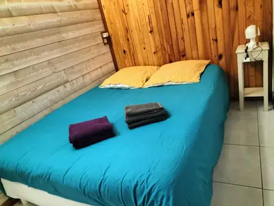 Un ou plusieurs lits dans un hébergement de l'établissement Gîte chez Kaky