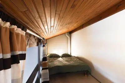 Un ou plusieurs lits dans un hébergement de l'établissement Maisonnette au pied de l'Océan avec terrasse