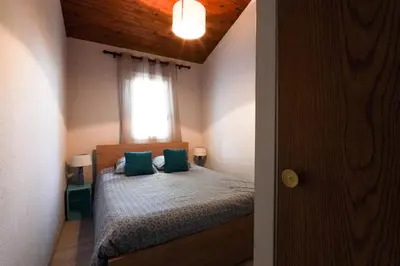 Un ou plusieurs lits dans un hébergement de l'établissement Maisonnette au pied de l'Océan avec terrasse