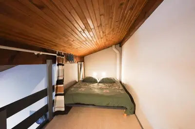 Un ou plusieurs lits dans un hébergement de l'établissement Maisonnette au pied de l'Océan avec terrasse