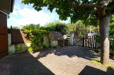 Jardin de l'établissement Maisonnette au pied de l'Océan avec terrasse