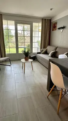 Coin salon dans l'établissement appartement en residence PIERRE ET VACANCE au golf