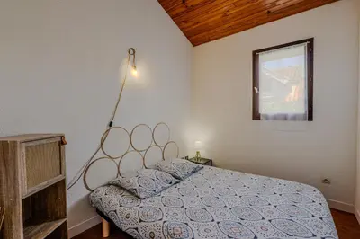 Un ou plusieurs lits dans un hébergement de l'établissement Maisonnette à 50m de la plage