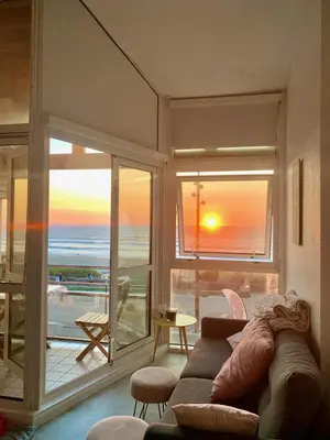 Coin salon dans l'établissement Appartement cosy avec vue océan à Mimizan 6 personnes