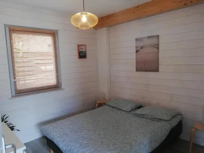 Un ou plusieurs lits dans un hébergement de l'établissement Appartement proche lac et plage