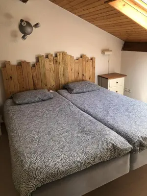 Un ou plusieurs lits dans un hébergement de l'établissement Villa OCELANDES