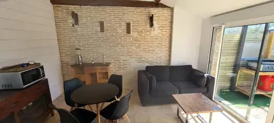 Télévision ou salle de divertissement dans l'établissement Appartement Ychoux