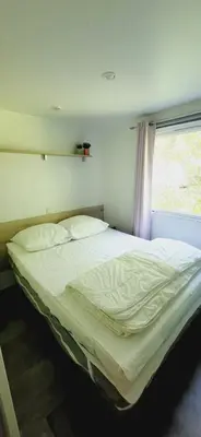Un ou plusieurs lits dans un hébergement de l'établissement Mobil Home 4 6 pers climatisé Camping Eurolac