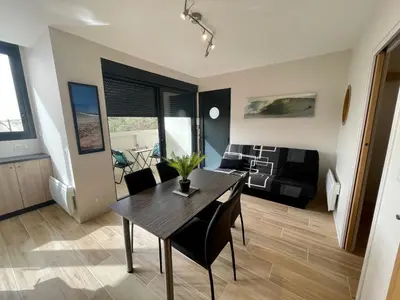 Coin salon dans l'établissement Les terrasses de l'océan A11