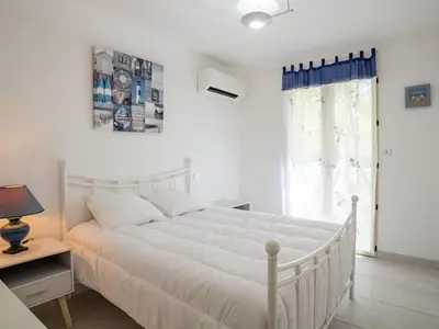 Un ou plusieurs lits dans un hébergement de l'établissement Holiday Home Laouchet by Interhome