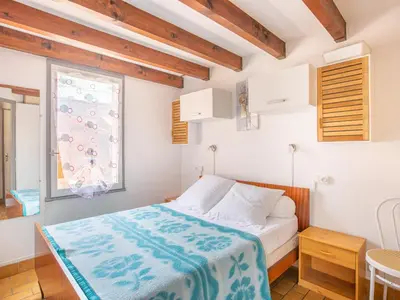 Un ou plusieurs lits dans un hébergement de l'établissement Maison T2 Mezzanine à 350m des Plages avec Terrasse et Parking à Biscarrosse - FR-1-521-182