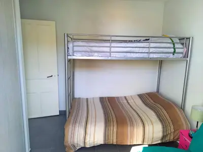 Un ou plusieurs lits dans un hébergement de l'établissement CAPBRETON -Appartement rez de jardin quartier proche centre et plages 5 pers