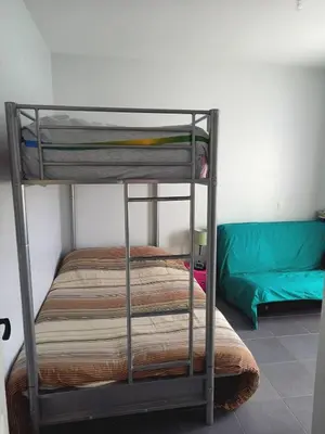 Un ou plusieurs lits dans un hébergement de l'établissement CAPBRETON -Appartement rez de jardin quartier proche centre et plages 5 pers
