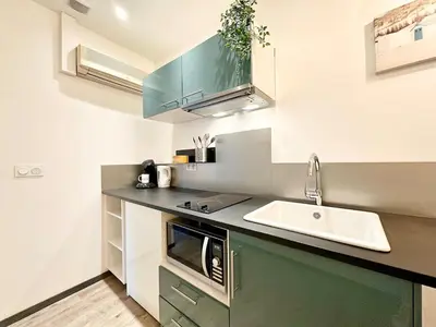 Cuisine ou kitchenette dans l'établissement Le Saint Roch - Hyper Centre - Clim - Cosy - Rénové