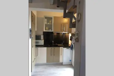 Cuisine ou kitchenette dans l'établissement Appartement tout confort proche plage