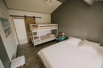 Un ou plusieurs lits dans un hébergement de l'établissement Maison Kyma