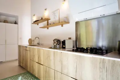 Cuisine ou kitchenette dans l'établissement La Maison Boisée - Welkeys