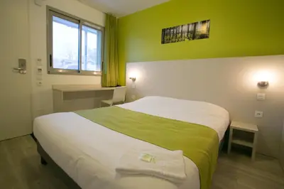 Un ou plusieurs lits dans un hébergement de l'établissement Motel des Landes