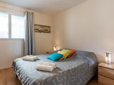 Un ou plusieurs lits dans un hébergement de l'établissement Appartement T2 avec piscine, proche océan, linge et ménage inclus, à Biscarrosse Plage - FR-1-319-455