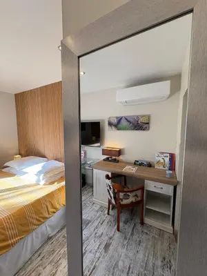 Un ou plusieurs lits dans un hébergement de l'établissement Chambres d'Hôtes Villa Aquitaine