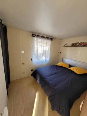 Un ou plusieurs lits dans un hébergement de l'établissement Mobil Home Plage Lac Parentis/Biscarosse