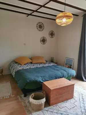 Un ou plusieurs lits dans un hébergement de l'établissement maison de vacances Mont de Marsan