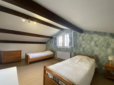 Un ou plusieurs lits dans un hébergement de l'établissement Maison familiale landaise à 350m de la plage avec garage, 4 chambres et jardin - FR-1-413-185