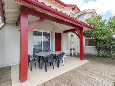 Balcon ou terrasse dans l'établissement Maisonnette 2 étoiles à Mimizan Plage à 200m de l'océan, 6 pers, terrasse, parking, tout confort - FR-1-50-75