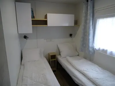 Un ou plusieurs lits dans un hébergement de l'établissement Escape MobilHome aux Dunes de Contis