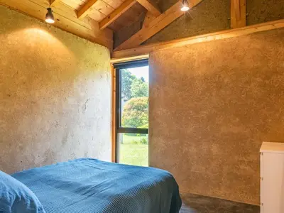Un ou plusieurs lits dans un hébergement de l'établissement Holiday Home La Grange du Belon by Interhome