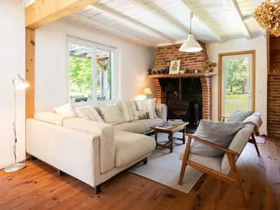 Coin salon dans l'établissement Holiday Home La Grange du Belon by Interhome