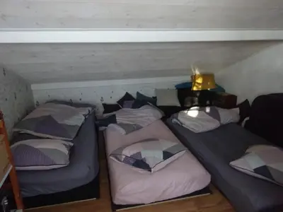 Un ou plusieurs lits dans un hébergement de l'établissement Maison familiale Landaise pour 2 couples, enfants