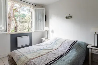 Un ou plusieurs lits dans un hébergement de l'établissement LA PETITE MAISON DU LAC