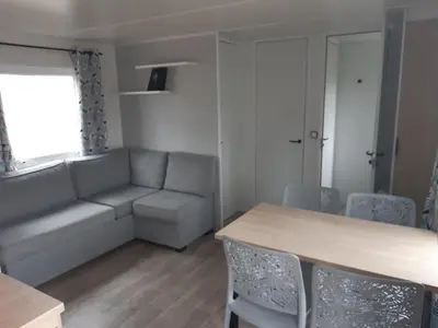 Coin salon dans l'établissement GUIG99 camping les dunes de Contis