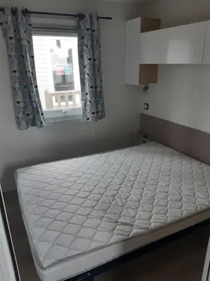 Un ou plusieurs lits dans un hébergement de l'établissement GUIG99 camping les dunes de Contis