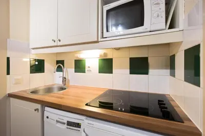 Cuisine ou kitchenette dans l'établissement Le Domaine du Golf de Pinsolle - maeva Home - Appartement 2 Pièces 4 personnes - Sélection MAE-8890