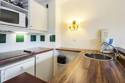Cuisine ou kitchenette dans l'établissement Le Domaine du Golf de Pinsolle - maeva Home - Appartement 2 pièces 6 personnes - Confort MAE-9354
