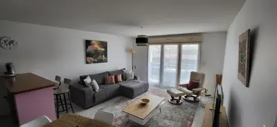 Coin salon dans l'établissement Appartement Lit et Mixe