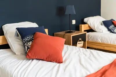 Un ou plusieurs lits dans un hébergement de l'établissement Jolie maison LE TEICH bassin Park/wifi