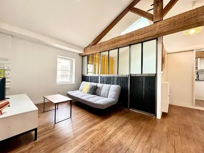 Coin salon dans l'établissement Le Petit Landais - Chaleureux - Clim - Central