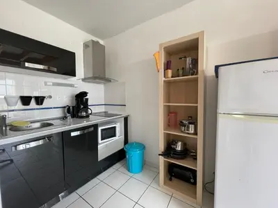 Cuisine ou kitchenette dans l'établissement Le Tournesol