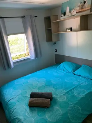 Un ou plusieurs lits dans un hébergement de l'établissement Le mobilhome de Evelyne et Serge