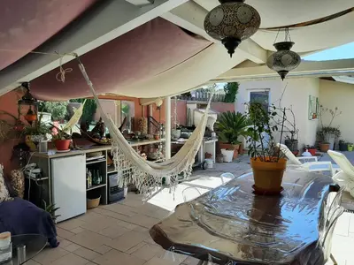 Restaurant ou autre lieu de restauration dans l'établissement Grande maison familiale avec piscine et varangue à Tarnos, proche plages et commerces - FR-1-239-779