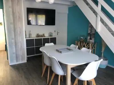 Télévision ou salle de divertissement dans l'établissement Villa de vacances Vieux Boucau