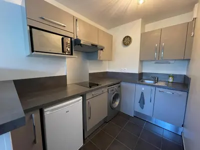 Cuisine ou kitchenette dans l'établissement The Barbots apartment