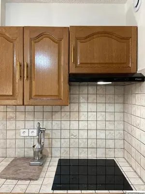 Cuisine ou kitchenette dans l'établissement Grand appartement en résidence calme avec piscine