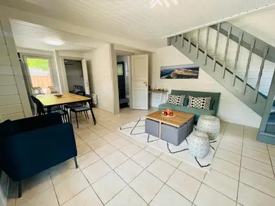 Coin salon dans l'établissement Chalet domaine forge 6-8pers jacuzzi terrasse plancha proche commerces