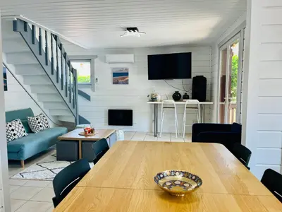 Coin salon dans l'établissement Chalet domaine forge 6-8pers jacuzzi terrasse plancha proche commerces