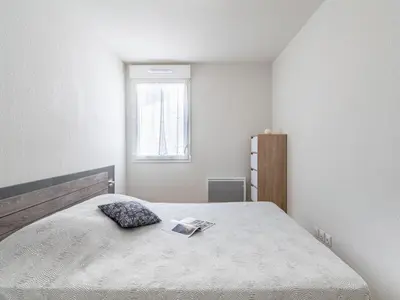 Un ou plusieurs lits dans un hébergement de l'établissement Apartment SC H01 by Interhome