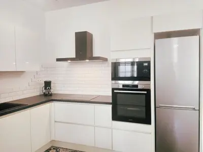 Cuisine ou kitchenette dans l'établissement Okera
